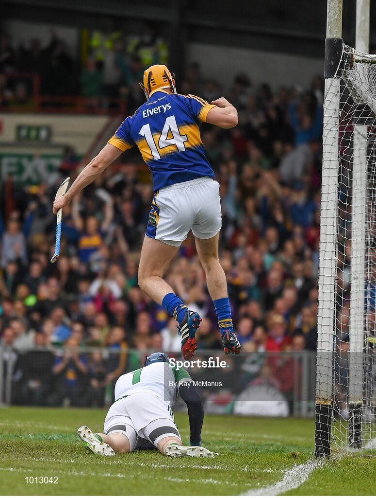 21 June 2015; Seamus Callanan jumps out over the Limerick goalkeeper Barry Hennessy as he celebrates scoring the second tipperary goal in the 22nd minute.  Munster GAA Hurling Senior Championship, Semi-Final, Limerick v Tipperary, Gaelic Grounds, Limerick. Picture credit: Ray McManus / SPORTSFILE