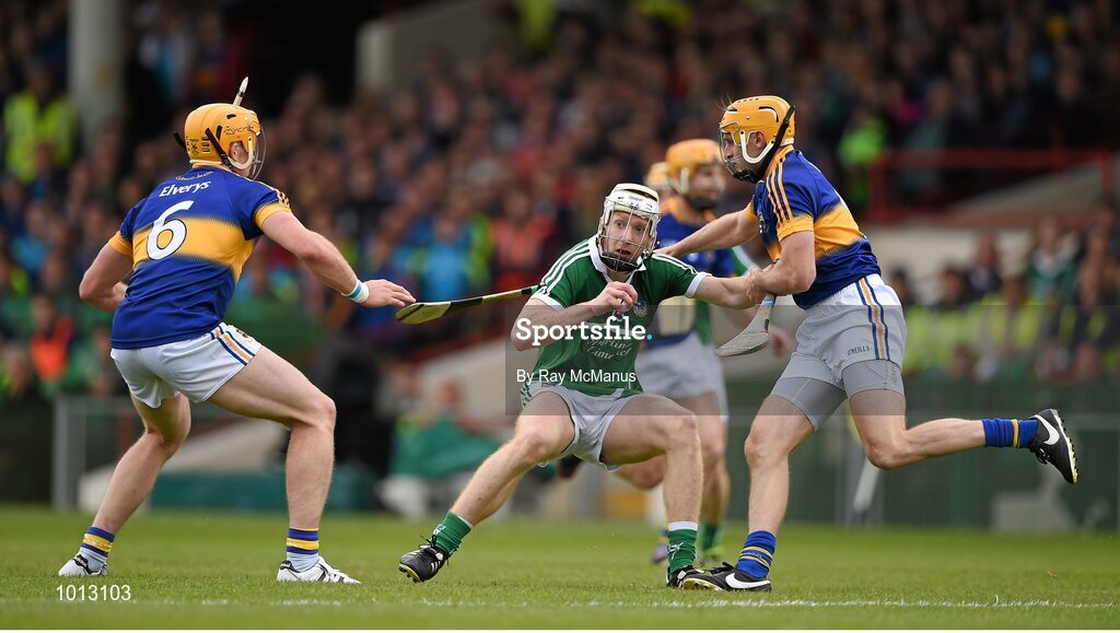 21 June 2015; Cian Lynch, Limerick, in action against Padraic Maher, left, and Shane McGrath, Tipperary. Munster GAA Hurling Senior Championship, Semi-Final, Limerick v Tipperary, Gaelic Grounds, Limerick. Picture credit: Ray McManus / SPORTSFILE