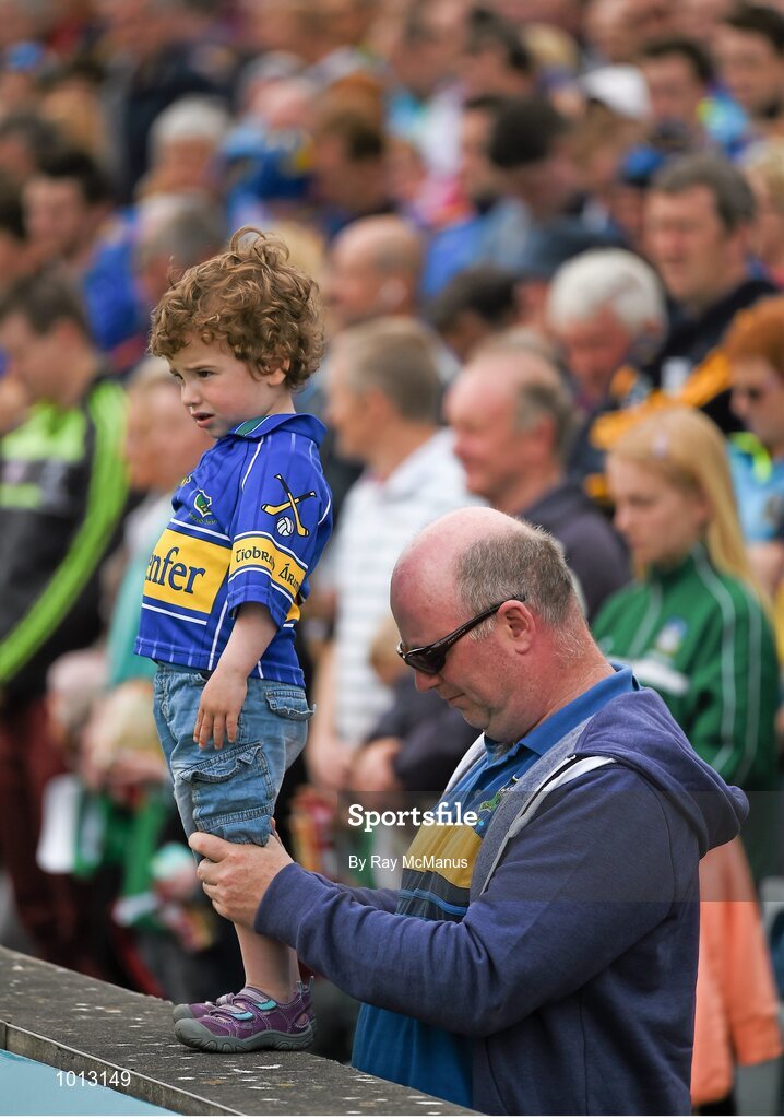21 June 2015; Supporters of both Tipperary and Limerick including three year old Kieran Matthewxs and his dad Neil, from Roscrea, stand in silence in memory of the those who died and were injured in the 'Berkley' tragedy. Munster GAA Hurling Senior Championship, Semi-Final, Limerick v Tipperary, Gaelic Grounds, Limerick. Picture credit: Ray McManus / SPORTSFILE