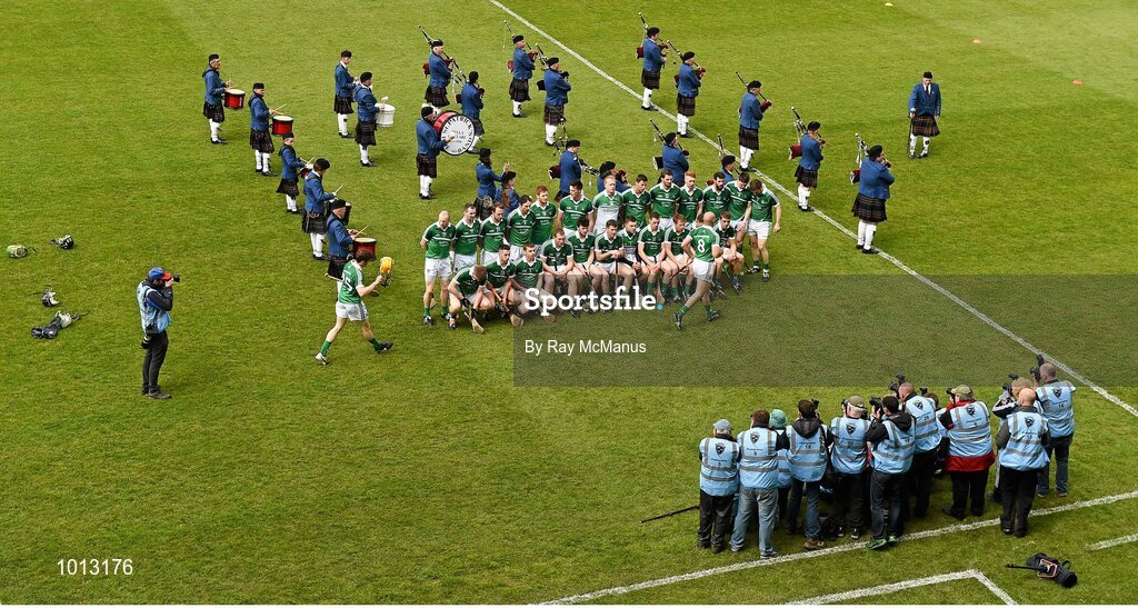 21 June 2015; The Limerick players assemble for the team photograph as the St Patrick's Pipe Band, from Tulla, Co Clare, play on. Munster GAA Hurling Senior Championship, Semi-Final, Limerick v Tipperary, Gaelic Grounds, Limerick. Picture credit: Ray McManus / SPORTSFILE