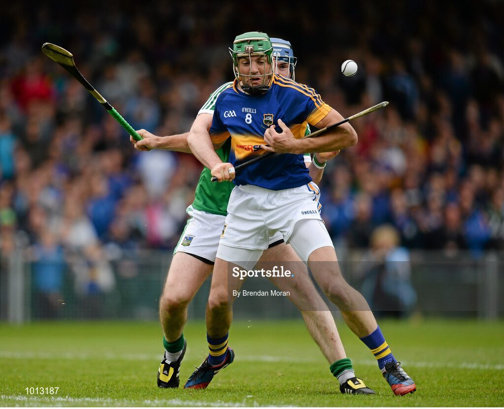 21 June 2015; James Woodlock, Tipperary, is tackled by Richie McCarthy, Limerick. Munster GAA Hurling Senior Championship, Semi-Final, Limerick v Tipperary, Gaelic Grounds, Limerick. Picture credit: Brendan Moran / SPORTSFILE