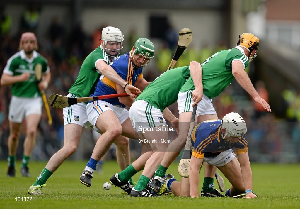 21 June 2015; John O'Dwyer, left, and Niall O'Meara, Tipperary, compete for possession with Limerick players, from left, Tom Condon, Stephen Walsh and Richie McCarthy. Munster GAA Hurling Senior Championship, Semi-Final, Limerick v Tipperary, Gaelic Grounds, Limerick. Picture credit: Brendan Moran / SPORTSFILE