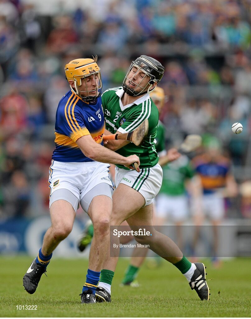 21 June 2015; Shane McGrath, Tipperary, clashes with John Fitzgibbon, Limerick, as they compete for possession. Munster GAA Hurling Senior Championship, Semi-Final, Limerick v Tipperary, Gaelic Grounds, Limerick. Picture credit: Brendan Moran / SPORTSFILE