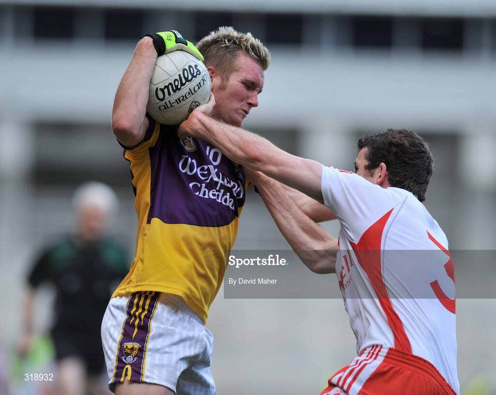 31 August 2008; P.J Banville, Wexford, in action against Justin McMahon, Tyrone. GAA Football All-Ireland Senior Championship Semi-Final, Tyrone v Wexford, Croke Park, Dublin. Picture credit: David Maher / SPORTSFILE