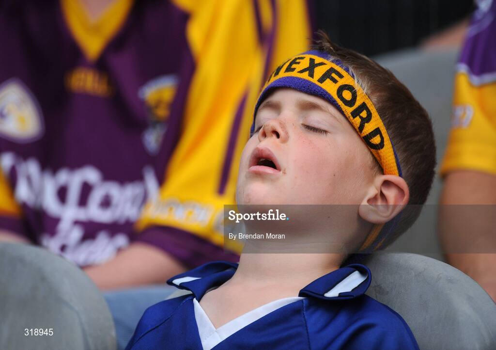 31 August 2008; Wexford fan Brian Stafford, age 5, from Ferns, Co. Wexford, takes in a snooze during half-time. GAA Football All-Ireland Senior Championship Semi-Final, Tyrone v Wexford, Croke Park, Dublin. Picture credit: Brendan Moran / SPORTSFILE