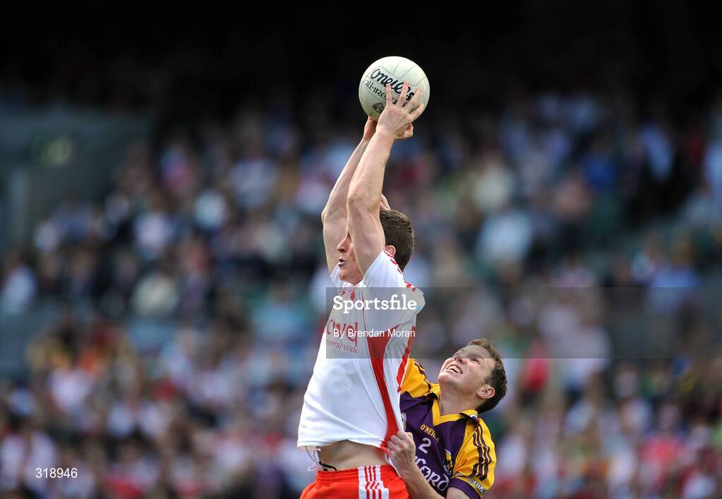 31 August 2008; Tommy McGuigan, Tyrone, fields a high ball ahead of David Walsh, Wexford. GAA Football All-Ireland Senior Championship Semi-Final, Tyrone v Wexford, Croke Park, Dublin. Picture credit: Brendan Moran / SPORTSFILE
