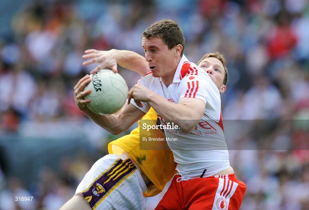 31 August 2008; Tommy McGuigan, Tyrone, fields a high ball ahead of David Walsh, Wexford. GAA Football All-Ireland Senior Championship Semi-Final, Tyrone v Wexford, Croke Park, Dublin. Picture credit: Brendan Moran / SPORTSFILE