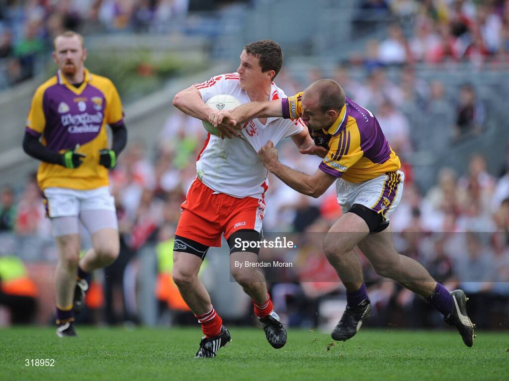 31 August 2008; Tommy McGuigan, Tyrone, is tackled by Philip Wallace, Wexford. GAA Football All-Ireland Senior Championship Semi-Final, Tyrone v Wexford, Croke Park, Dublin. Picture credit: Brendan Moran / SPORTSFILE