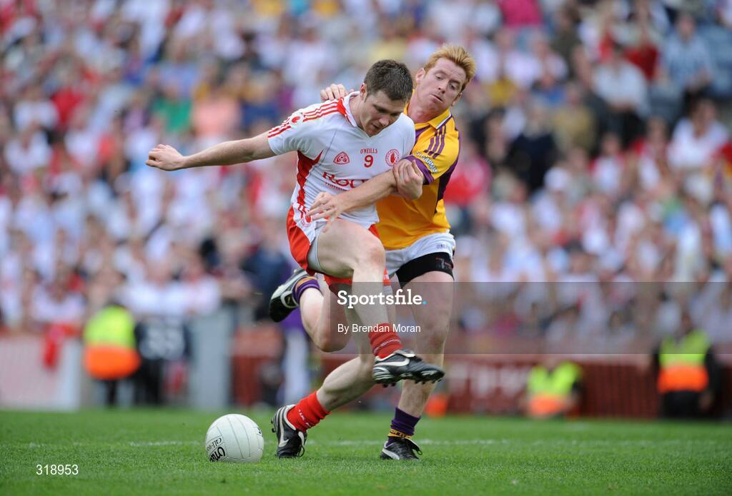 31 August 2008; Enda McGinley, Tyrone, is dispossessed by Eric Bradley, Wexford. GAA Football All-Ireland Senior Championship Semi-Final, Tyrone v Wexford, Croke Park, Dublin. Picture credit: Brendan Moran / SPORTSFILE