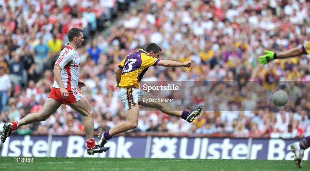 31 August 2008; Ciaran Lyng, Wexford, beats Colin Holmes, Tyrone to score his side's first goal. GAA Football All-Ireland Senior Championship Semi-Final, Tyrone v Wexford, Croke Park, Dublin. Picture credit: David Maher / SPORTSFILE