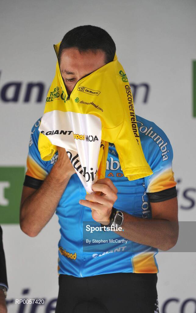 31 August 2008; Marco Pinotti, Team Columbia, pulls on the race winners yellow jersey after winning the 2008 Tour of Ireland. 2008 Tour of Ireland - Stage 5, Killarney - Cork. Picture credit: Stephen McCarthy / SPORTSFILE
