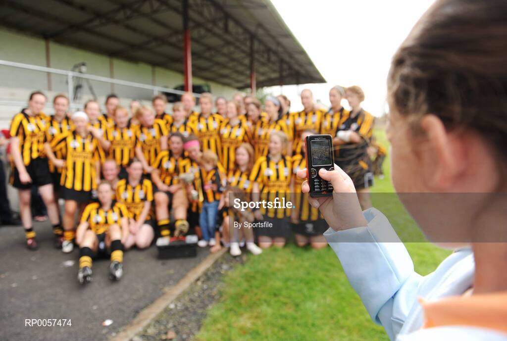 31 August 2008; A fan takes a picture on her mobile phone of the winning Kilkenny team. All-Ireland Minor A Championship Final, Clare v Kilkenny, Geraldine Park, Athy, Co. Kildare. Photo by Sportsfile