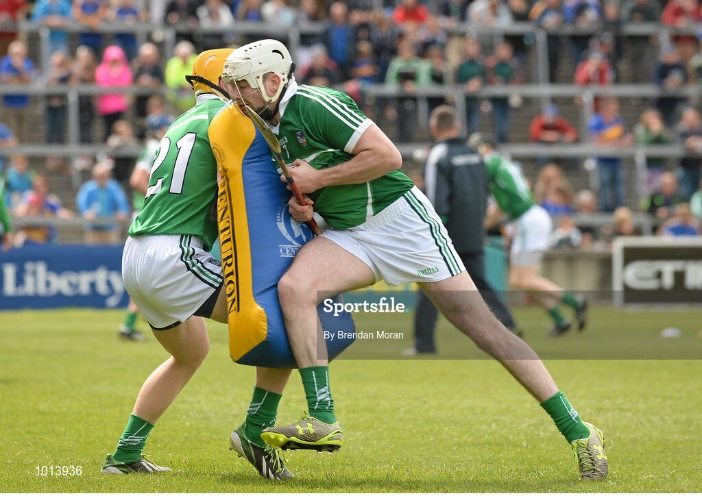 21 June 2015; Limerick players Paul Browne, left, and Tom Condon use tackle bags in their warm-up ahead of the game. Munster GAA Hurling Senior Championship, Semi-Final, Limerick v Tipperary, Gaelic Grounds, Limerick. Picture credit: Brendan Moran / SPORTSFILE