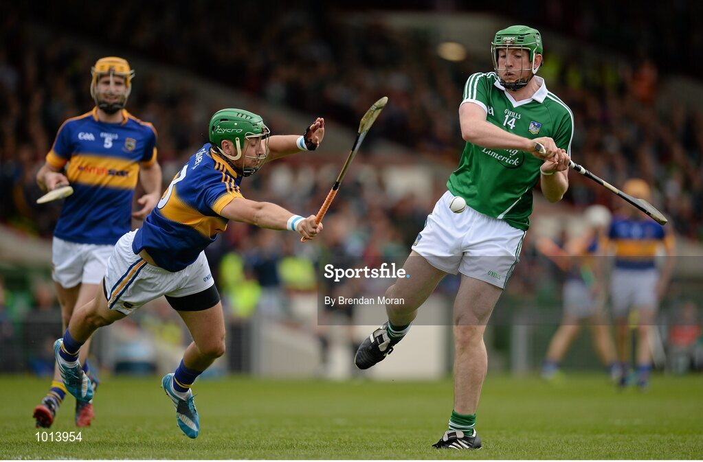 21 June 2015; Shane Dowling, Limerick, has his shot blocked by James Barry, Tipperary. Munster GAA Hurling Senior Championship, Semi-Final, Limerick v Tipperary, Gaelic Grounds, Limerick. Picture credit: Brendan Moran / SPORTSFILE