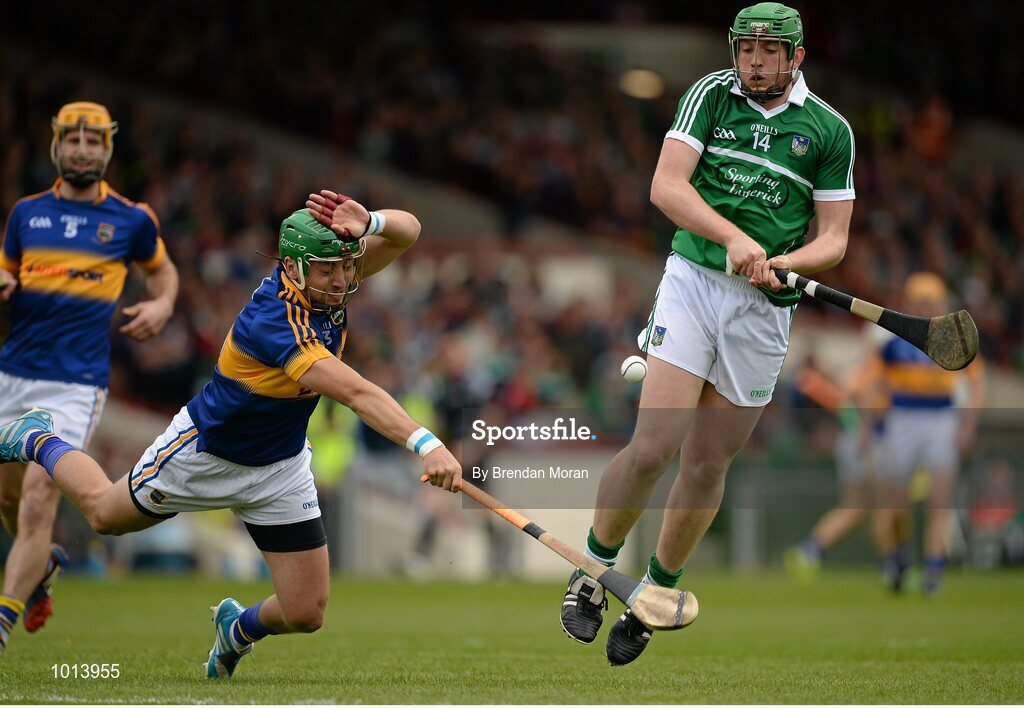 21 June 2015; Shane Dowling, Limerick, has his shot blocked by James Barry, Tipperary. Munster GAA Hurling Senior Championship, Semi-Final, Limerick v Tipperary, Gaelic Grounds, Limerick. Picture credit: Brendan Moran / SPORTSFILE