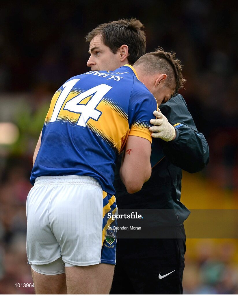 21 June 2015; Seamus Callanan, Tipperary, is attended to by medical personnel before leaving the pitch for a blood injury. Munster GAA Hurling Senior Championship, Semi-Final, Limerick v Tipperary, Gaelic Grounds, Limerick. Picture credit: Brendan Moran / SPORTSFILE