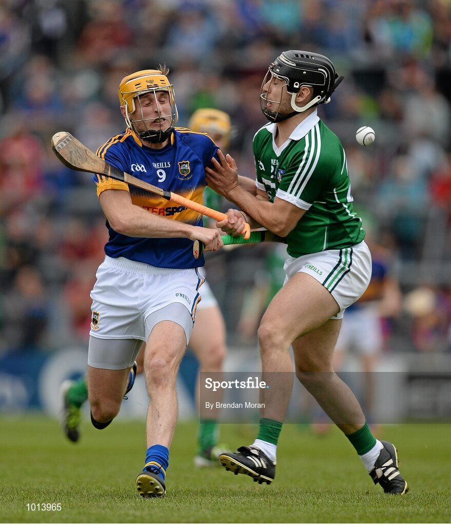 21 June 2015; Shane McGrath, Tipperary, clashes with John Fitzgibbon, Limerick, as they compete for possession. Munster GAA Hurling Senior Championship, Semi-Final, Limerick v Tipperary, Gaelic Grounds, Limerick. Picture credit: Brendan Moran / SPORTSFILE