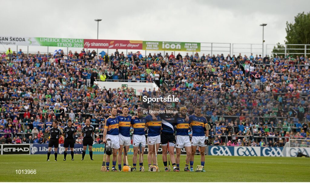 21 June 2015; The teams and match officials stand during a minute's silence in memory of the those who died and were injured in the 'Berkeley' tragedy. Munster GAA Hurling Senior Championship, Semi-Final, Limerick v Tipperary, Gaelic Grounds, Limerick. Picture credit: Brendan Moran / SPORTSFILE