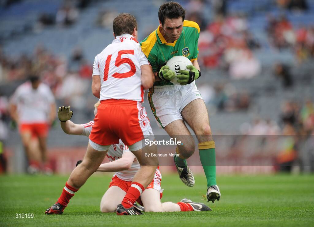 31 August 2008; Tommy Johnson, Meath, is shouldered by Conor O'Neill, Tyrone. ESB GAA Football All-Ireland Minor Championship Semi-Final, Meath v Tyrone, Croke Park, Dublin. Picture credit: Brendan Moran / SPORTSFILE