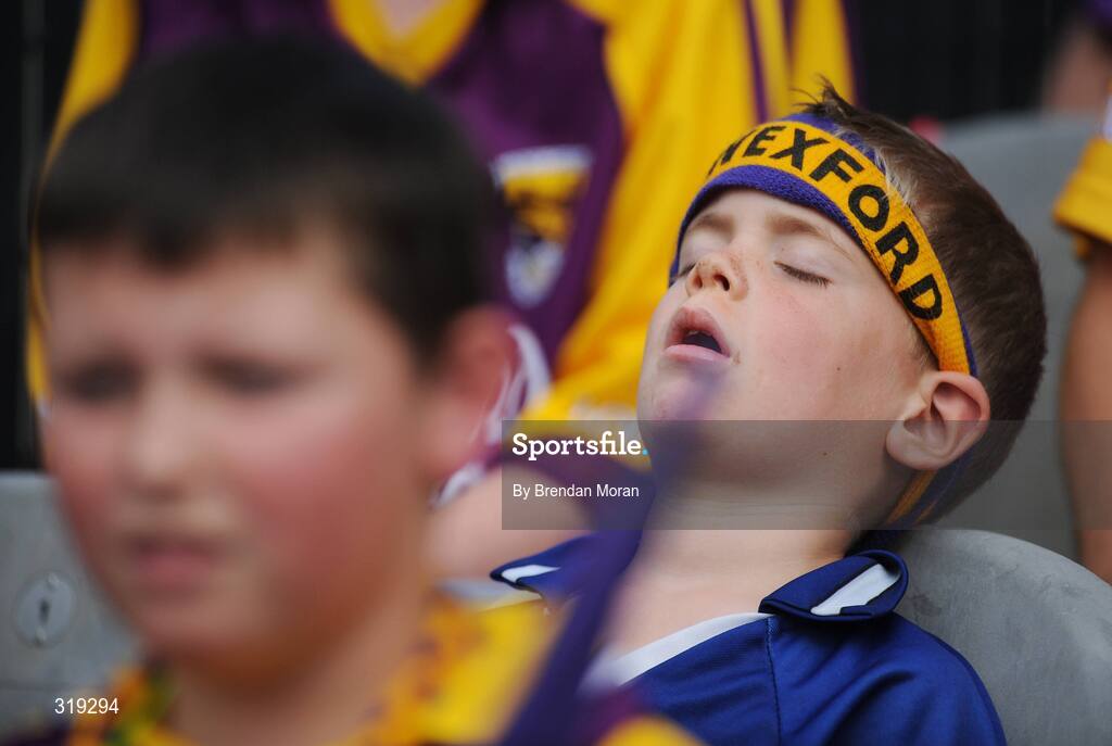 31 August 2008; Wexford fan Brian Stafford, age 5, from Ferns, Co. Wexford, takes in a snooze during half-time. GAA Football All-Ireland Senior Championship Semi-Final, Tyrone v Wexford, Croke Park, Dublin. Picture credit: Brendan Moran / SPORTSFILE