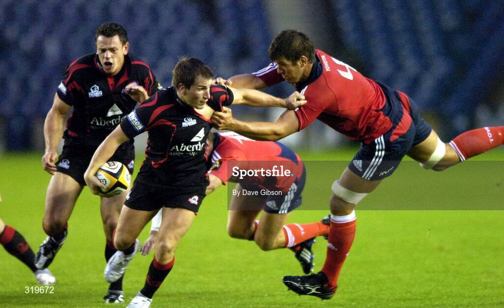 5 September 2008; Phil Godman, Edinburgh, is tackled by Donncha O'Callaghan, Munster. Magners League, Edinburgh v Munster, Murrayfield Stadium, Edinburgh, Scotland. Picture credit: Dave Gibson / SPORTSFILE