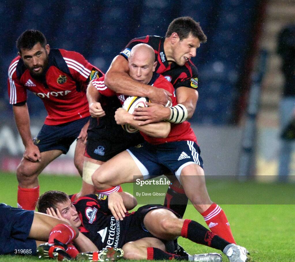 5 September 2008; Peter Stringer, Munster, is tackled by David Callam, Edinburgh. Magners League, Edinburgh v Munster, Murrayfield Stadium, Edinburgh, Scotland. Picture credit: Dave Gibson / SPORTSFILE