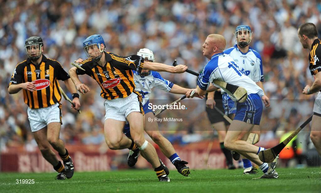 7 September 2008; Brian Hogan, Kilkenny, prepares to clear under pressure from Waterford forwards Stephen Molumphy, left, and John Mullane. GAA Hurling All-Ireland Senior Championship Final, Kilkenny v Waterford, Croke Park, Dublin. Picture credit: Ray McManus / SPORTSFILE