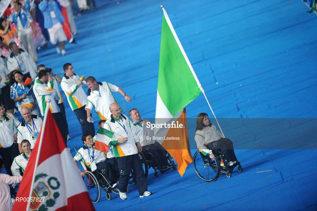 6 September 2008; Flag bearer Patrice Dockery, from Swords, Dublin, who competes in the Wheelchair 100m, 200m, & 400m leads the Ireland team out during the Opening Ceremony of the Beijing Paralympic Games 2008, National Stadium, Olympic Green, Beijing, China. Picture credit: Brian Lawless / SPORTSFILE