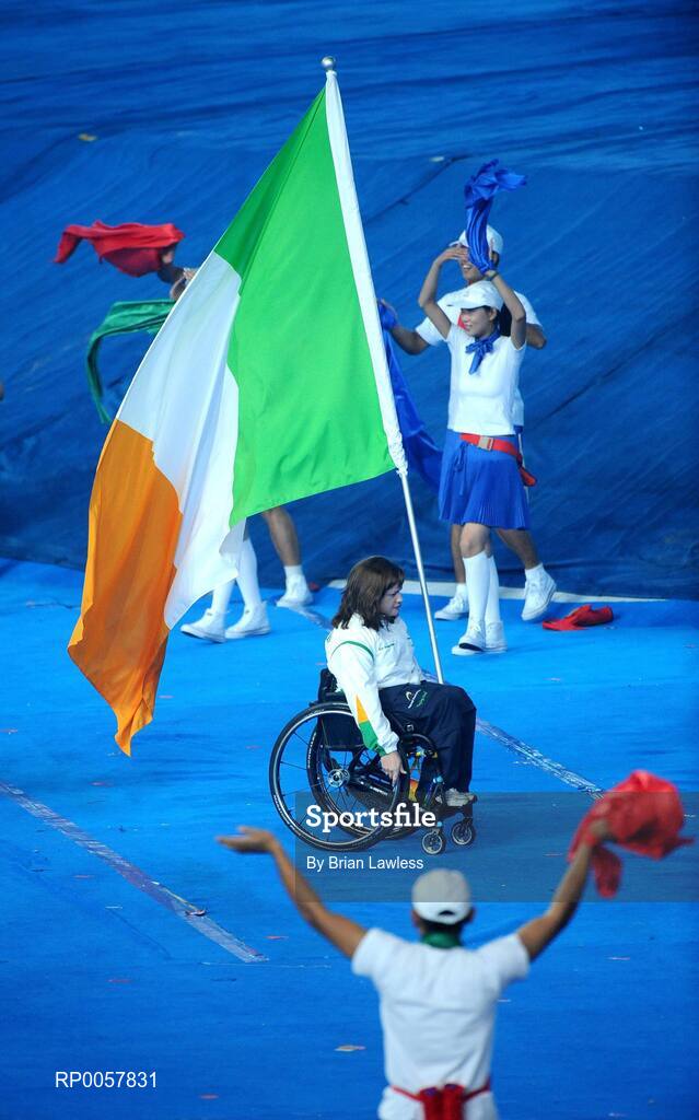 6 September 2008; Flag bearer Patrice Dockery, from Swords, Dublin, who competes in the Wheelchair 100m, 200m, & 400m leads the Ireland team out during the Opening Ceremony of the Beijing Paralympic Games 2008, National Stadium, Olympic Green, Beijing, China. Picture credit: Brian Lawless / SPORTSFILE
