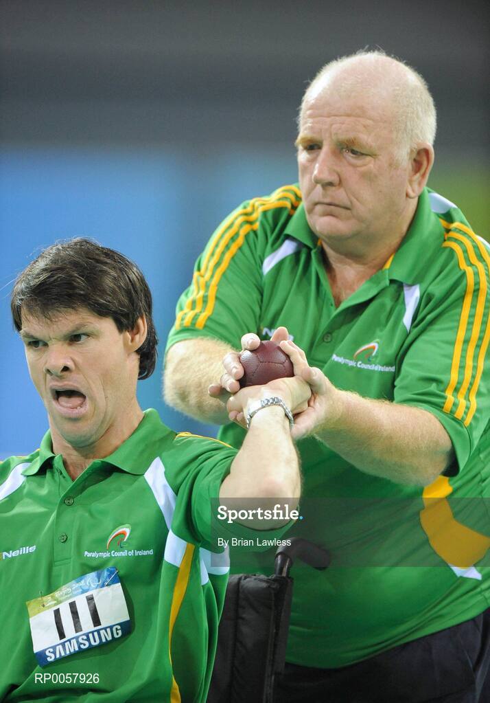 7 September 2008; Gabriel Shelly, from Bagenalstown, Co. Carlow, is assisted by Patrick 'Rocky' Judge during his opening pool match of the Individual Boccia competition against Brock Richardson of Canada. Gabriel won the match 4-2. Beijing Paralympic Games 2008, Mixed Individual Boccia BC1, Pool D, Fencing Hall of National Convention Centre, Olympic Green, Beijing, China. Picture credit: Brian Lawless / SPORTSFILE