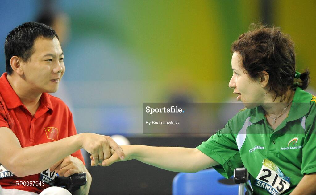 7 September 2008; Roberta 'Bobbie' Connolly, from Fockrock, Dublin, shakes hands with Fei Cao of China after their opening match. Roberta lost her match 5-0 before going on to win her second match 4-3 against Roberto Leglice of Argentina. Beijing Paralympic Games 2008, Mixed Individual Boccia BC2, Pool G, Fencing Hall of National Convention Centre, Olympic Green, Beijing, China. Picture credit: Brian Lawless / SPORTSFILE