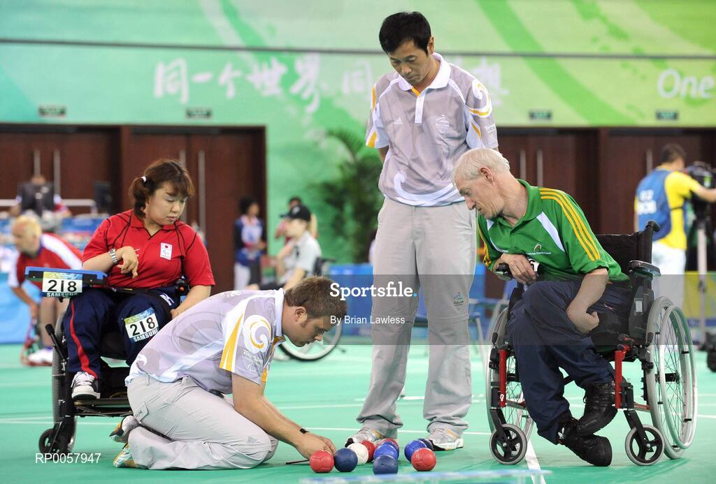 7 September 2008; Tom Leahy, from Fermoy, Co. Cork, watches as distances are measured during his opening pool match of the Individual Boccia competition against Risa Kainuma of Japan. Tom lost his match 4-2. Beijing Paralympic Games 2008, Mixed Individual Boccia BC2, Pool B, Fencing Hall of National Convention Centre, Olympic Green, Beijing, China. Picture credit: Brian Lawless / SPORTSFILE