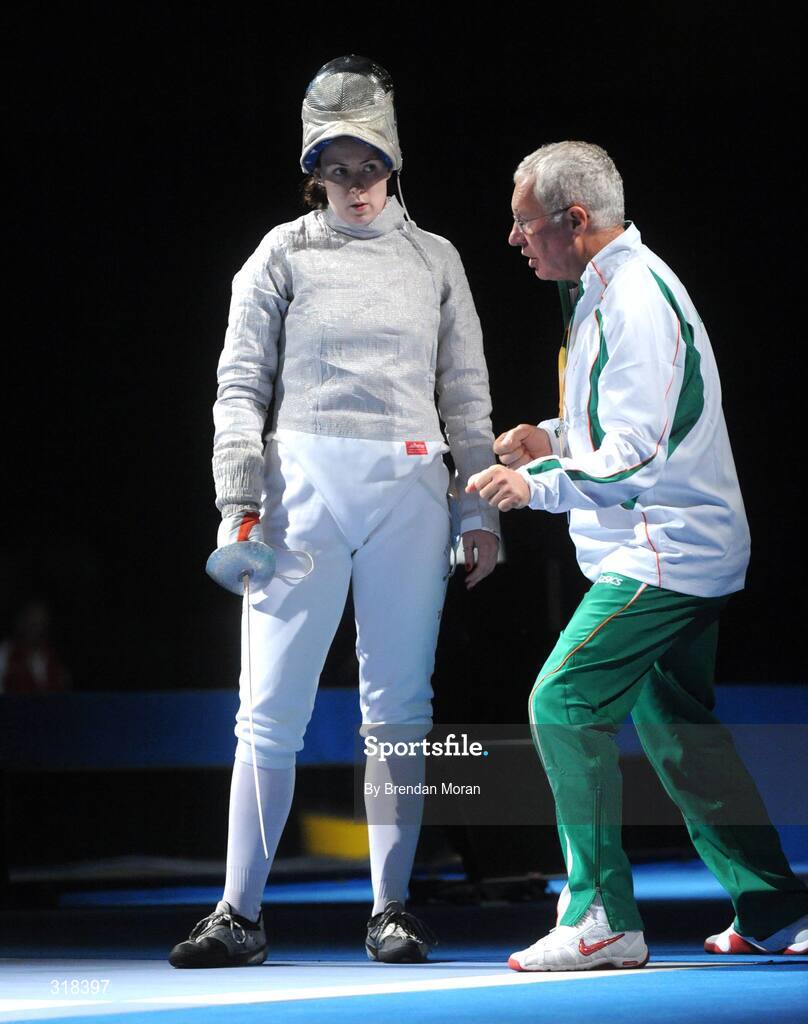 9 August 2008; Siobhan Byrne, Ireland, is spoken to by her coach Vladimir Nazlymov during her bout against Irena Wieckowska, Poland. where she lost 15-8. Beijing 2008 - Games of the XXIX Olympiad, Fencing Hall of National Convention Centre, Olympic Green, Beijing, China. Picture credit: Brendan Moran / SPORTSFILE
