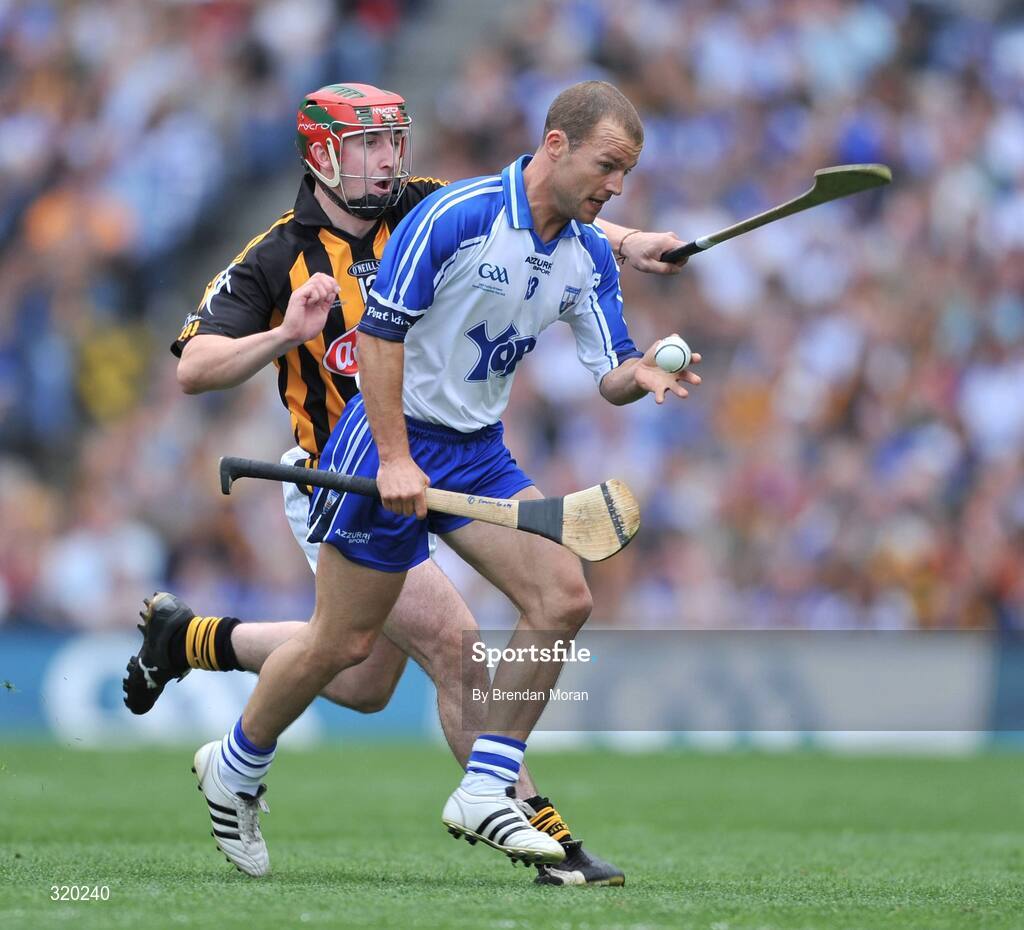 7 September 2008; Eoin McGrath, Waterford, handpasses the sliothar away despte the attentions of Eoin Larkin, Kilkenny. GAA Hurling All-Ireland Senior Championship Final, Kilkenny v Waterford, Croke Park, Dublin. Picture credit: Brendan Moran / SPORTSFILE