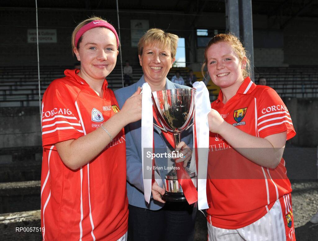 31 August 2008; Uachtaran Cumann Peil Gael na mBan Geraldine Giles presents Cork co-captains Denise Cronin, right, and Ciara Sherlock, with the cup. All-Ireland Ladies U16 A Football Championship Final, Cork v Galway, McDonagh Park, Nenagh, Co. Tipperary. Picture credit: Brian Lawless / SPORTSFILE