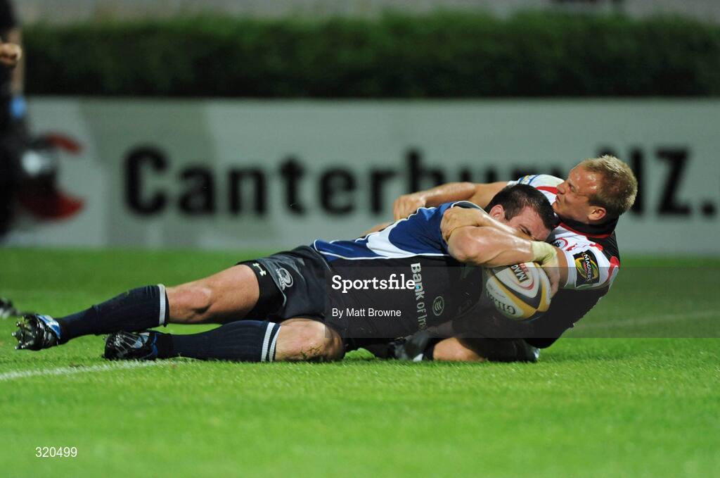 12 September 2008; Shane Jennings, Leinster, goes over for his try against Edinburgh despite the tackle from Andrew Turnbull. Magners League, Leinster v Edinburgh, RDS, Ballsbridge, Dublin.  Picture credit: Matt Browne / SPORTSFILE