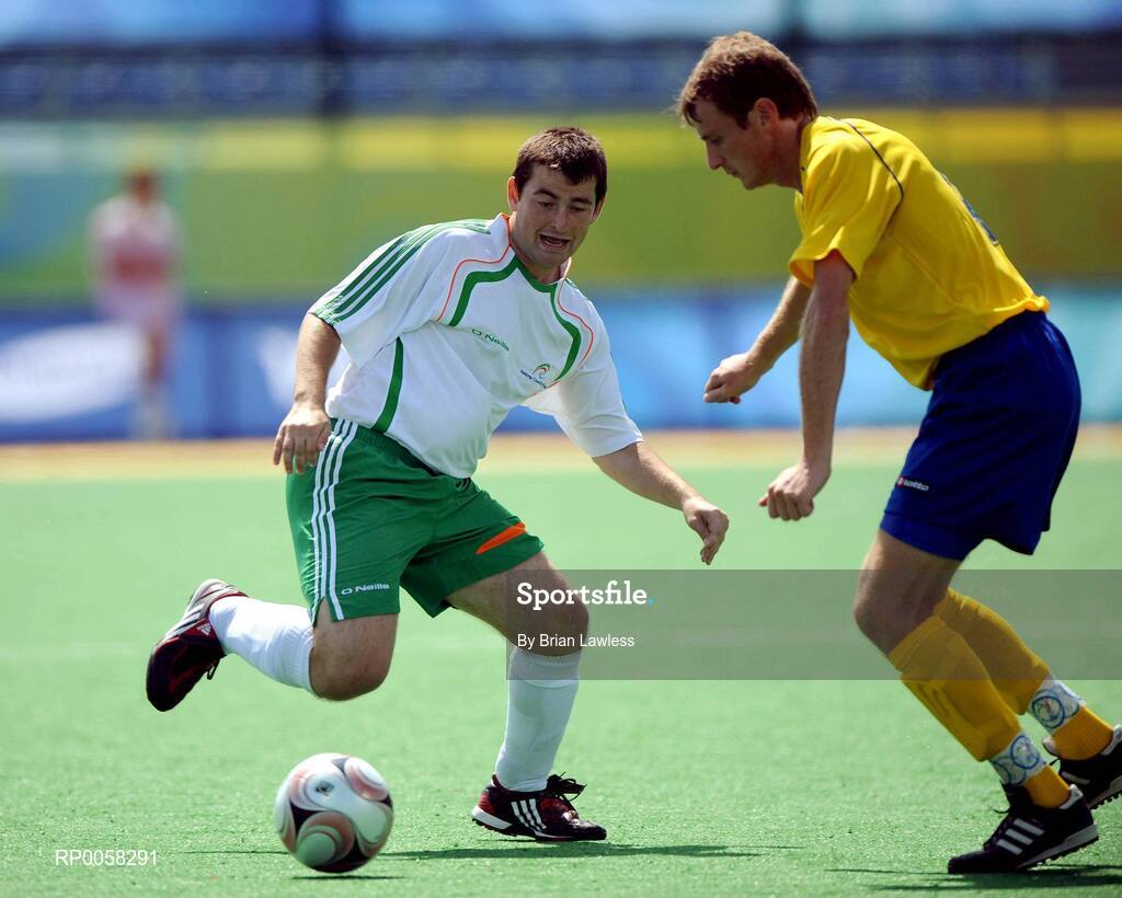 10 September 2008; Patrick Devlin, Ireland, in action against Denys Ponomaryov, Ukraine. Ireland lost their match 7-0 and will face Great Britain in their final group match this coming Friday the 12th. Beijing Paralympic Games 2008, Ireland v Ukraine, 7-A-Side Soccer, First Round, Group B, Match 6, Olympic Green Hockey Field A, Beijing, China. Picture credit: Brian Lawless / SPORTSFILE