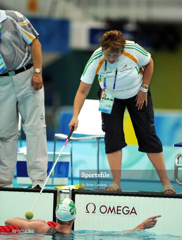 11 September 2008; Ireland's Stephen Campbell, from Cookstown, Tyrone, is helped from the pool by Swimming manager Geraldine Conway after the Men's 400m Freestyle - S11 heats. Stephen set a new Irish record with a time of 5:28.43 beating his PB by over 6 seconds. Beijing Paralympic Games 2008, Men's 400m Freestyle - S11, Heat 2, National Aquatic Centre, Olympic Green, Beijing, China. Picture credit: Brian Lawless / SPORTSFILE