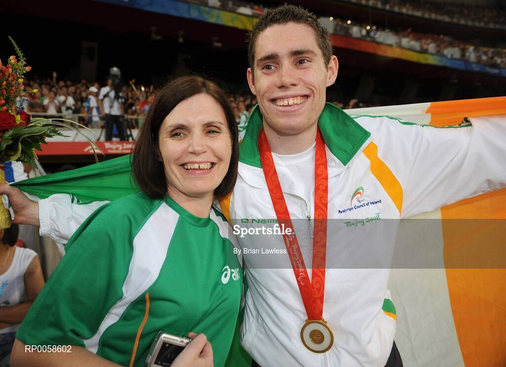 13 September 2008; Ireland's Jason Smyth, from Eglington, Co. Derry, celebrates with his mother Diane after winning Gold in the Men's 100m T13 Final and set a new world and paralympic record in a time of 10.62, beating his own world record of 10.81 which he set in this mornings heats. Beijing Paralympic Games 2008, Men's 100m T13 Final, National Stadium, Olympic Green, Beijing, China. Picture credit: Brian Lawless / SPORTSFILE