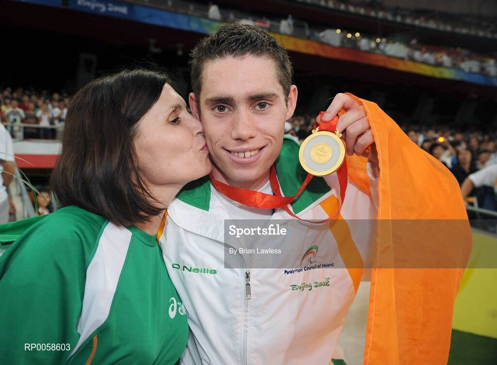13 September 2008; Ireland's Jason Smyth, from Eglinton, Co. Derry, celebrates with his mother Diane after winning Gold in the Men's 100m T13 Final and set a new world and paralympic record in a time of 10.62, beating his own world record of 10.81 which he set in this mornings heats. Beijing Paralympic Games 2008, Men's 100m T13 Final, National Stadium, Olympic Green, Beijing, China. Picture credit: Brian Lawless / SPORTSFILE