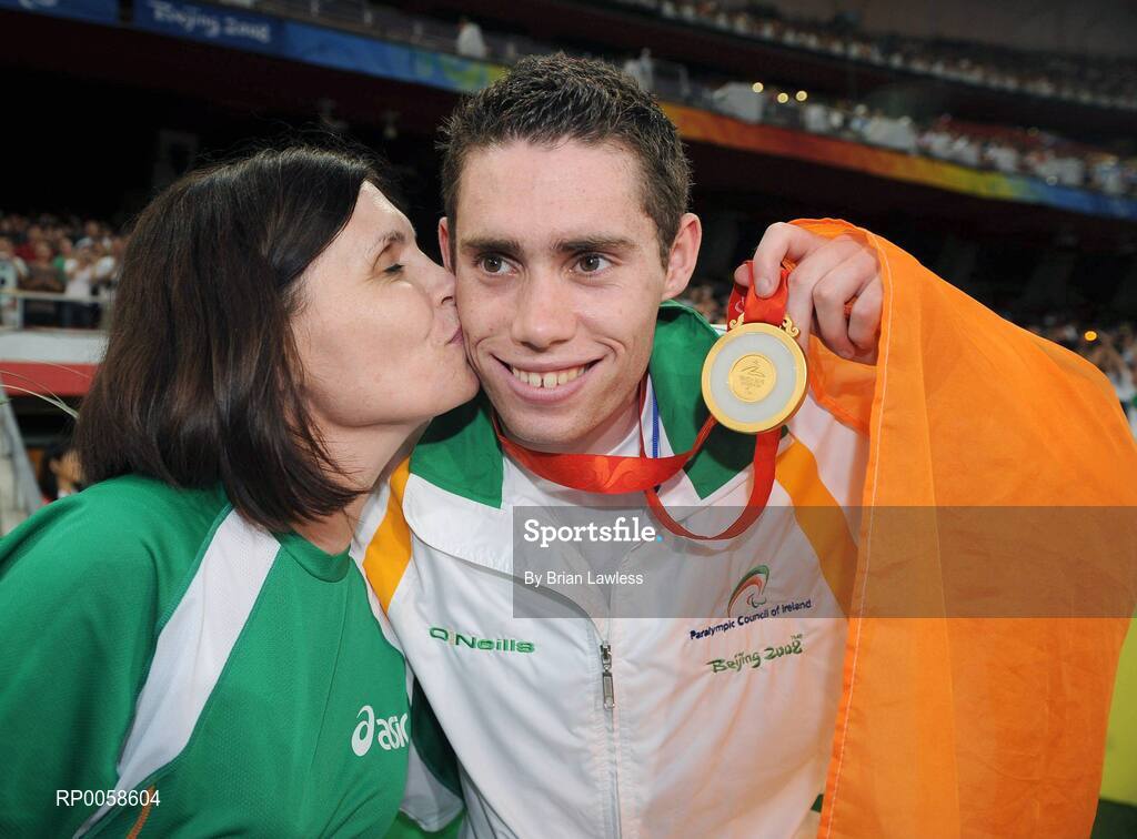 13 September 2008; Ireland's Jason Smyth, from Eglington, Co. Derry, celebrates with his mother Diane after winning Gold in the Men's 100m T13 Final and set a new world and paralympic record in a time of 10.62, beating his own world record of 10.81 which he set in this mornings heats. Beijing Paralympic Games 2008, Men's 100m T13 Final, National Stadium, Olympic Green, Beijing, China. Picture credit: Brian Lawless / SPORTSFILE