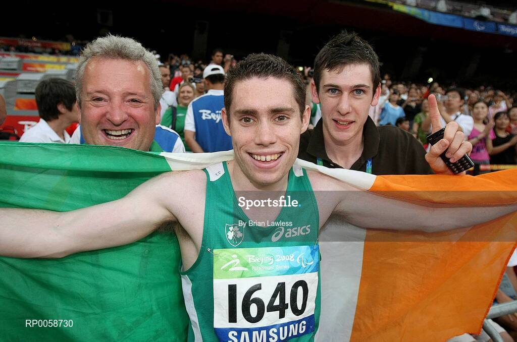 13 September 2008; Ireland's Jason Smyth, from Eglinton, Co. Derry, celebrates with coach Stephen Maguire, from Strabane, Tyrone, left, and 800m Gold medalist Michael McKillop, from Glengormley, Antrim, after winning the Men's 100m T13 Final to win Gold and setting a new world and paralympic record in a time of 10.62, beating his own world record of 10.81 which he set in this morning's heats. Beijing Paralympic Games 2008, Men's 100m T13 Final, National Stadium, Olympic Green, Beijing, China. Picture credit: Brian Lawless / SPORTSFILE
