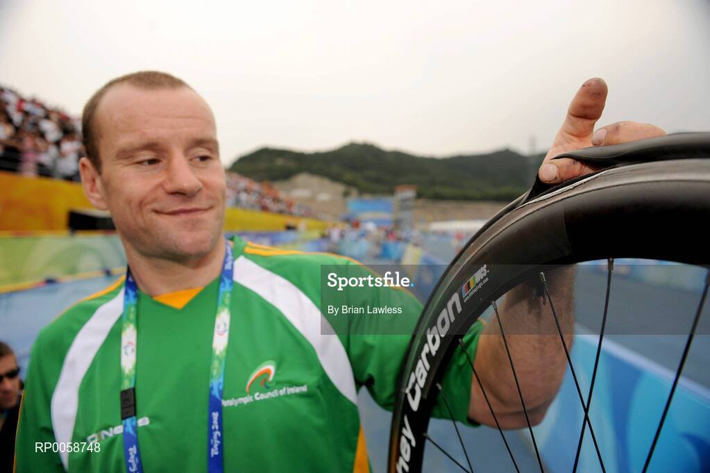 13 September 2008; Ireland's Cathal Miller, from Artane, Dublin, holds a bicycle wheel after the Men's Road Race - LC1 / 2 / CP4 over a distance of 72.6km. Miller's race was ended by a punctured back tyre on the 3rd lap as he was sitting comfortably in the leading pack. Beijing Paralympic Games 2008, Men's Road Race - LC1 / 2 / CP4, Road Cycling Course, Ming Tombs Reservoir, Beijing, China. Picture credit: Brian Lawless / SPORTSFILE