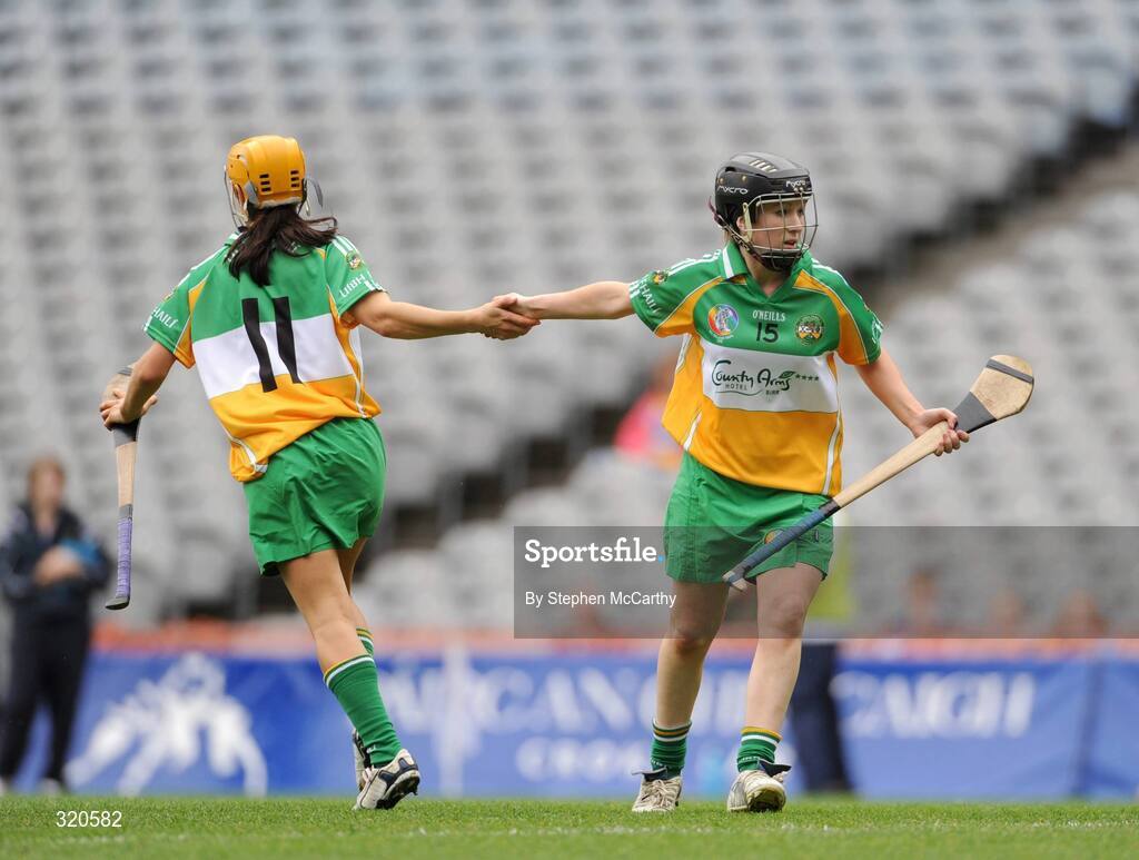 14 September 2008; Arlene Watkins, Offaly, is congratulated by team-mate Tina Hannon, 11, after scoring her side's first goal. Gala All-Ireland Junior Camogie Championship Final, Clare v Offaly, Croke Park, Dublin. Picture credit: Stephen McCarthy / SPORTSFILE *** Local Caption ***