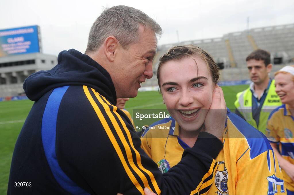 14 September 2008; Kate Lynch, Clare, is congratulated by Kevin Halpin after the match. Gala All-Ireland Junior Camogie Championship Final, Clare v Offaly, Croke Park, Dublin. Picture credit: Stephen McCarthy / SPORTSFILE *** Local Caption *** john myhil    kate