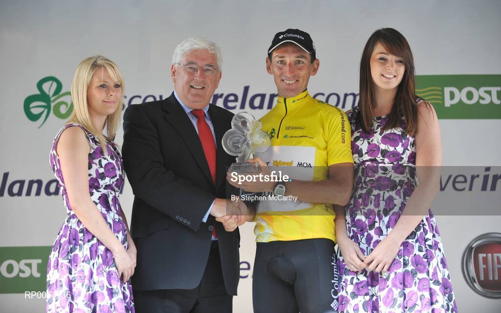 31 August 2008; Marco Pinotti, Team Columbia, is presented with his trophy by Minister for Education and Science Batt O'Keefe, T.D. after winning the Tour of Ireland. 2008 Tour of Ireland - Stage 5, Killarney - Cork. Picture credit: Stephen McCarthy / SPORTSFILE