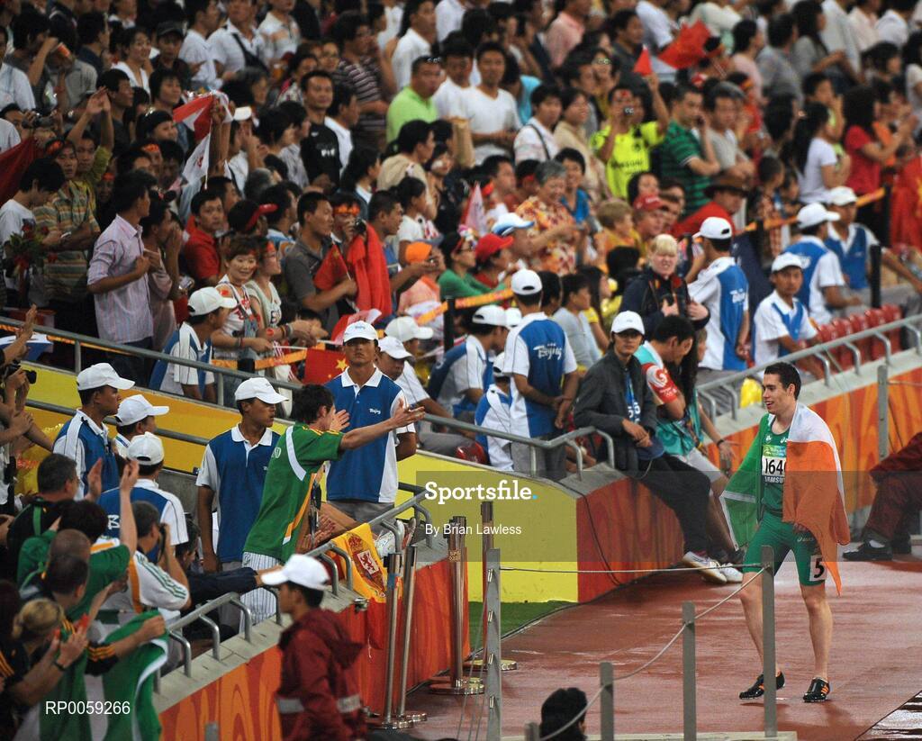 16 September 2008; Ireland's Jason Smyth, from Eglinton, Co. Derry, makes his way to 800m T37 gold medalist Michael McKillop, from Glengormley, Antrim, after winning the Men's 200m -T13 Final. Smyth won his second gold of these Paralympic games in a World record time of 21.43 seconds, his first coming in the Men's 100m T13 Final also in a world record time of 10.62. Beijing Paralympic Games 2008, Men's 200m -T13, Final, National Stadium, Olympic Green, Beijing, China. Picture credit: Brian Lawless / SPORTSFILE