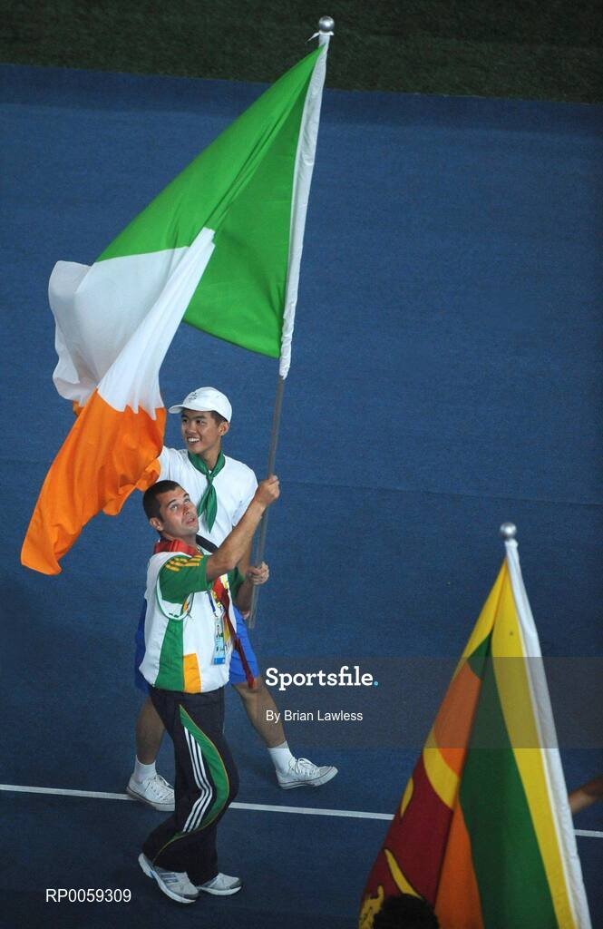 16 September 2008; Ireland's Finbarr O'Riordan, from Mitchelstown, Cork, a member of the 7-A-Side soccer team, carries the Tri-Colour during the Closing Ceremony. Beijing Paralympic Games 2008, Closing Ceremony, National Stadium, Olympic Green, Beijing, China. Picture credit: Brian Lawless / SPORTSFILE
