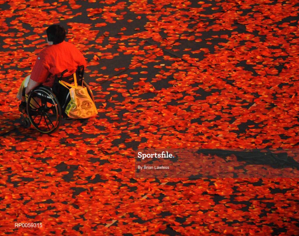16 September 2008; A Paralympic athlete makes their way through the red leaves of Fragrant Hill during the Closing Ceremony. Beijing Paralympic Games 2008, Closing Ceremony, National Stadium, Olympic Green, Beijing, China. Picture credit: Brian Lawless / SPORTSFILE
