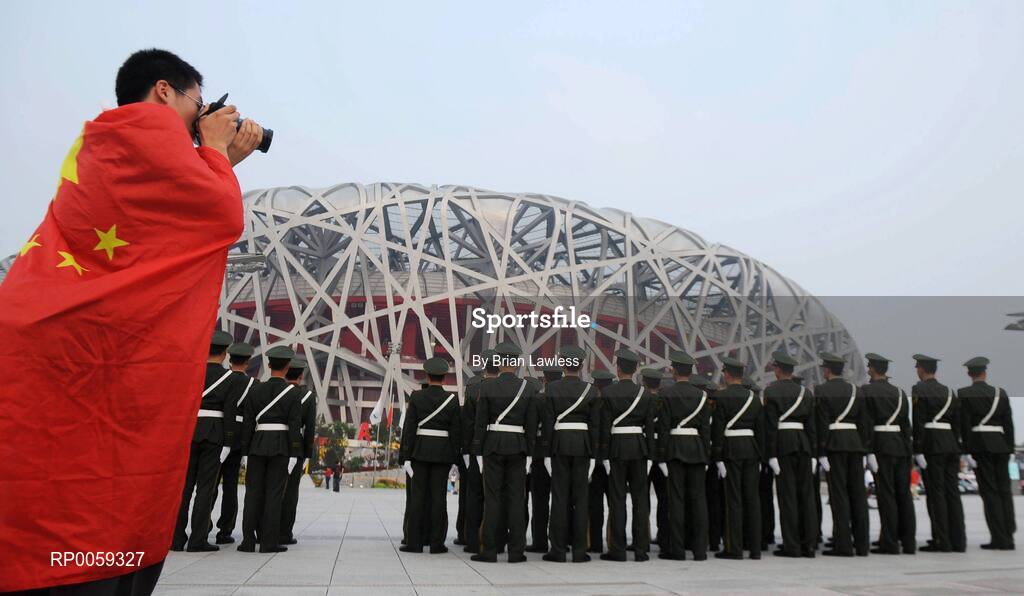 16 September 2008; A man takes photographs of members of the Chinese Army outside the 'Bird's Nest' prior to the Closing Ceremony. Beijing Paralympic Games 2008, Closing Ceremony, National Stadium, Olympic Green, Beijing, China. Picture credit: Brian Lawless / SPORTSFILE